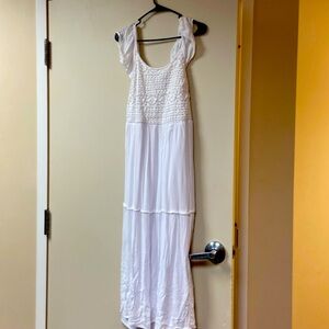Cute white summer dress. Ruffle cap sleeves, pucker stitched top.